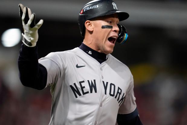 New York Yankees' Aaron Judge celebrates after hitting a two-run home run against the Cleveland Guardians during the eighth inning in Game 3 of the baseball AL Championship Series Thursday, Oct. 17, 2024, in Cleveland.(AP Photo/Godofredo Vásquez )