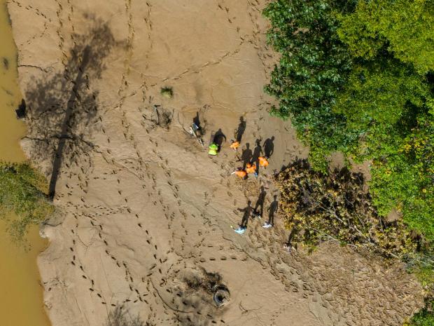 Search crews look for victims in the aftermath of Hurricane Helene, Tuesday, Oct. 1, 2024, in Swannanoa, N.C. (AP Photo/Mike Stewart)