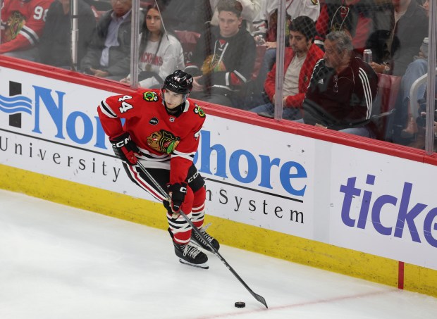 Blackhawks defenseman Wyatt Kaiser looks for an open teammate against the Tampa Bay Lightning at the United Center on Nov. 16, 2023.