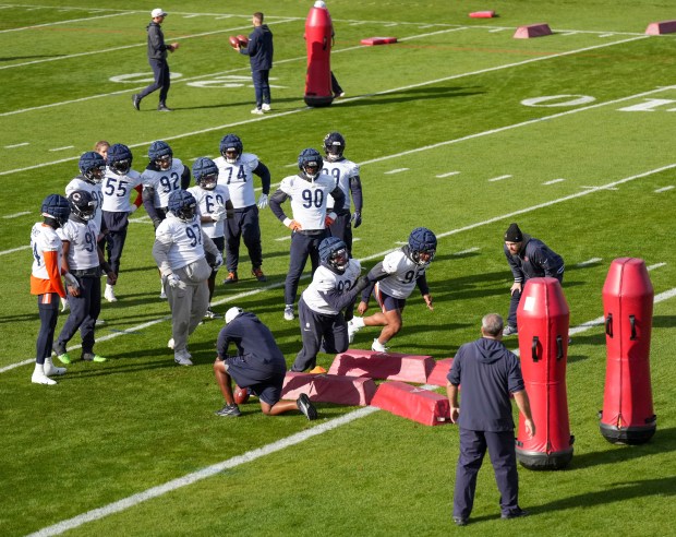 Chicago Bears defensive players run through drills, during a training session in Ware, England, Thursday, Oct. 10, 2024, ahead of the game between the Chicago Bears and the Jacksonville Jaguars at Tottenham Hotspur Stadium on Sunday. (AP Photo/Sean Ryan)