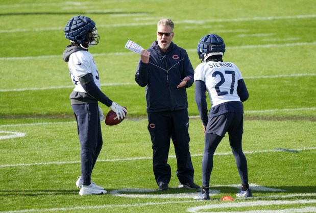 Bears coach Matt Eberflus talks with cornerback Reddy Steward during a training session on Oct. 10, 2024, in Ware, England, (Sean Ryan/AP)