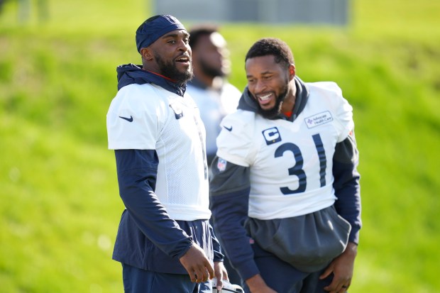 Chicago Bears cornerback Jaylon Johnson (1), left, and safety Kevin Byard III (31) participate in a NFL football training session in Ware, England, Friday, Oct. 11, 2024, ahead of the game against the Jacksonville Jaguars at the Tottenham Hotspur stadium on Sunday. (AP Photo/Kin Cheung)