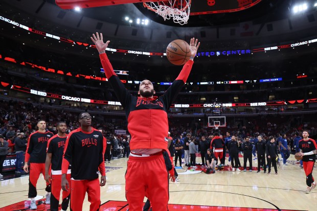 Bulls point guard Lonzo Ball warms up before a preseason game against the Timberwolves on Oct. 16, 2024, at the United Center. (Terrence Antonio James/Chicago Tribune)