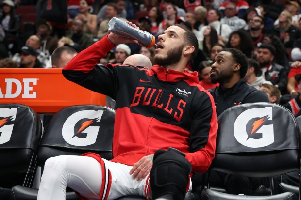 Bulls guard Lonzo Ball hydrates himself in the first half of a game against the Timberwolves at the United Center in Chicago on Oct. 16, 2024. (Terrence Antonio James/Chicago Tribune)