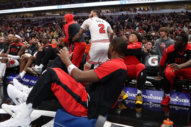 Teammates catch Bulls guard Lonzo Ball (2) after he saved a loose ball at the United Center in Chicago in the first half of a game against the Timberwolves on Oct. 16, 2024. (Terrence Antonio James/Chicago Tribune)