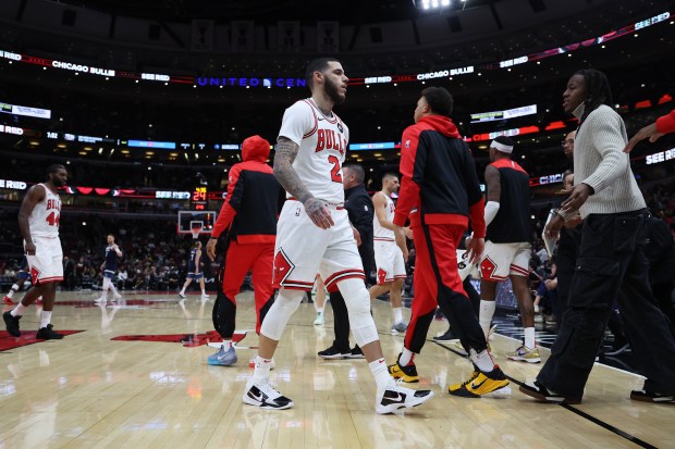 Bulls guard Lonzo Ball (2) heads to the bench during a timeout at the United Center in Chicago in a game against the Timberwolves on Oct. 16, 2024. (Terrence Antonio James/Chicago Tribune)