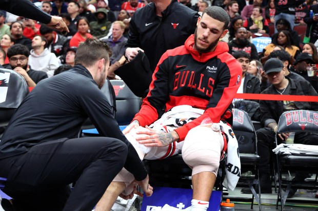 Bulls guard Lonzo Ball gets his legs wrapped in the second half of a game against the Timberwolves at the United Center in Chicago on Oct. 16, 2024. The Bulls won the preseason game 125-123. (Terrence Antonio James/Chicago Tribune)