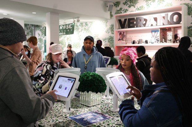 Customers order at kiosks inside Green Rose Dispensary in Chicago's River North neighborhood during the 420 Sesh Fest on April 20, 2024. (Chris Sweda/Chicago Tribune)