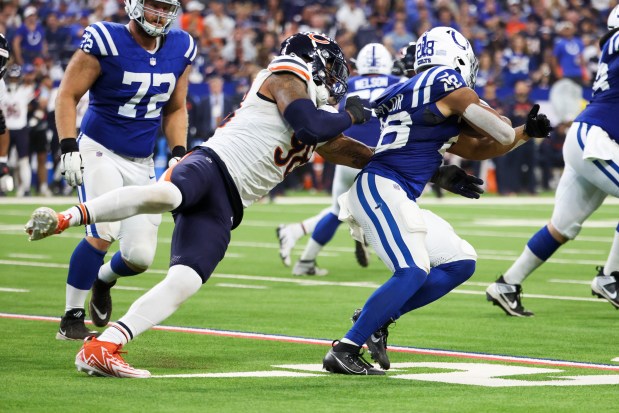 Bears defensive end Montez Sweat tackles Colts running back Jonathan Taylor on Sept. 22, 2024, in Indianapolis. (Eileen T. Meslar/Chicago Tribune)