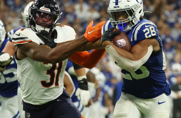 Indianapolis Colts running back Jonathan Taylor (28) runs past Chicago Bears safety Kevin Byard III (31) in the third quarter at Lucas Oil Stadium on Sept. 22, 2024, in Indianapolis. Taylor scored two touchdowns. The Colts beat the Bears 21-16. (Stacey Wescott/Chicago Tribune)