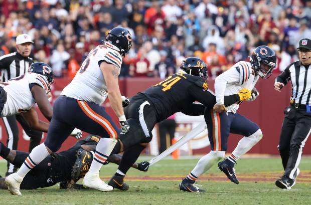 Commanders defensive tackle Daron Payne (94) sacks Bears quarterback Caleb Williams (18) in the second quarter at Northwest Stadium on Oct. 27, 2024, in Landover, Maryland. (John J. Kim/Chicago Tribune)