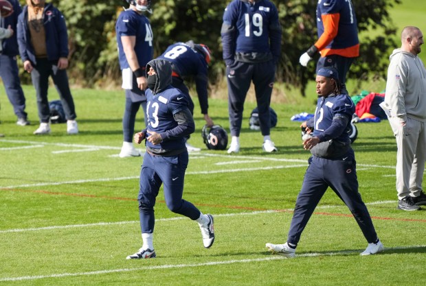 Bears wide receiver Keenan Allen (13) stretches during practice Thursday, Oct. 10, 2024, in Ware, England. (AP Photo/Sean Ryan)