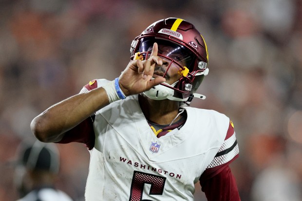 Commanders quarterback Jayden Daniels celebrates after throwing a 27-yard touchdown pass against the Bengals during the fourth quarter Monday, Sept. 23, 2024, in Cincinnati. (Andy Lyons/Getty Images)