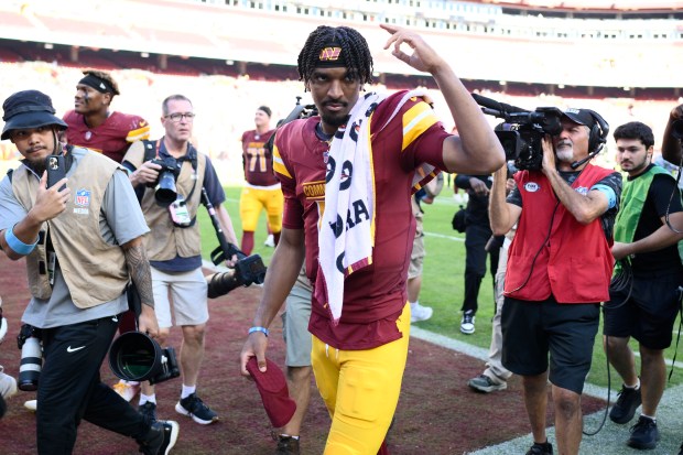 Commanders quarterback Jayden Daniels leaves the field after a victory against the Browns on Oct. 6, 2024, in Landover, Md. (AP Photo/Nick Wass)