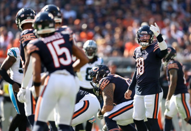 Bears quarterback Caleb Williams makes an adjustment at the line of scrimmage in the third quarter against the Panthers on Oct. 6, 2024, at Soldier Field. (Chris Sweda/Chicago Tribune)