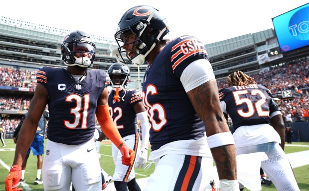 Bears safety Jonathan Owens celebrates with teammates after scoring a touchdown on a blocked-punt return in the third quarter against the Titans on Sept. 8, 2024, at Soldier Field. (Chris Sweda/Chicago Tribune)