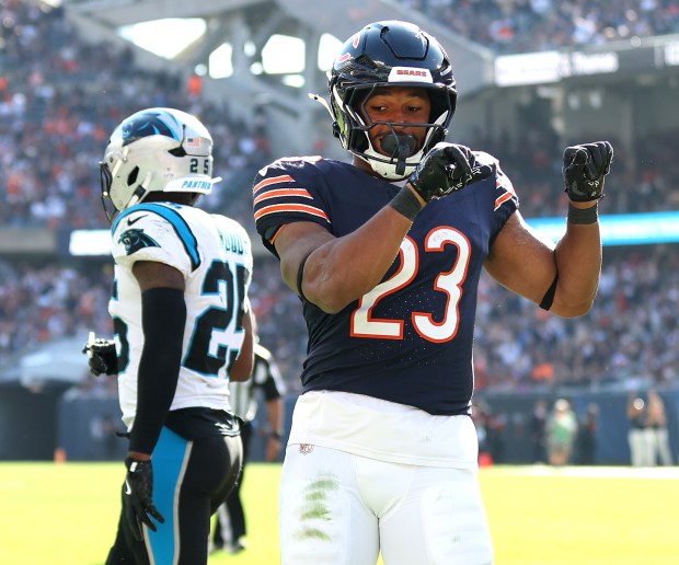 Bears running back Roschon Johnson celebrates after scoring a touchdown in the fourth quarter against the Panthers on Oct. 6, 2024, at Soldier Field. (Chris Sweda/Chicago Tribune)