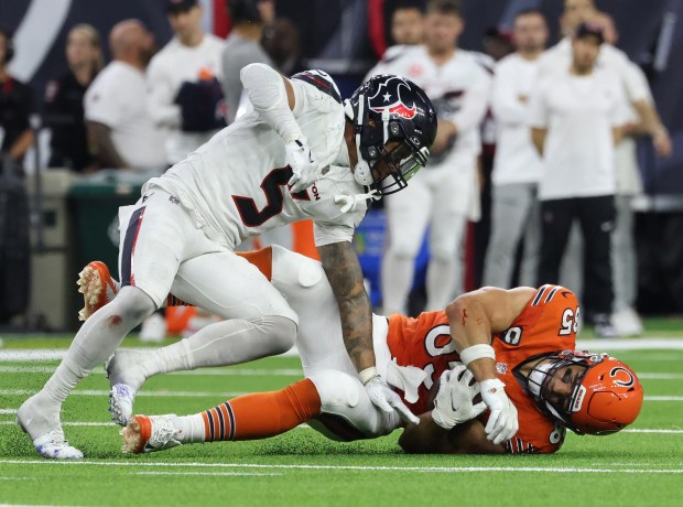 Bears tight end Cole Kmet takes a hard hit from Texans safety Jalen Pitre in the fourth quarter on Sept. 15, 2024, in Houston. (John J. Kim/Chicago Tribune)