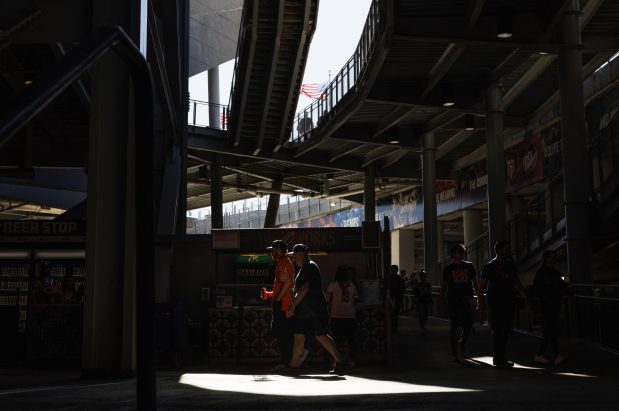 Fans walk through the Soldier Field concourse on Oct. 6, 2024. Hours after a Chicago Bears game that day, a man employed by a company offering food and beverage services at the football stadium slashed his co-worker with a knife following a verbal altercation. (Armando L. Sanchez/Chicago Tribune)