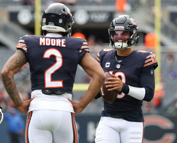 Bears wide receiver DJ Moore and quarterback Caleb Williams prepare to face the Rams on Sept. 29, 2024, at Soldier Field. (Brian Cassella/Chicago Tribune)