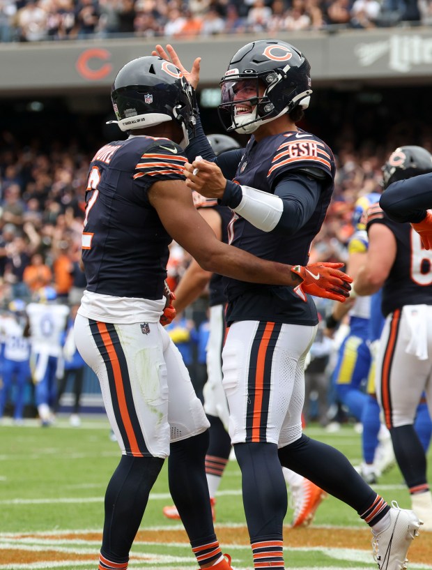 Bears quarterback Caleb Williams, right, celebrates his touchdown pass to DJ Moore against the Rams on Sept. 29, 2024, at Soldier Field. (Brian Cassella/Chicago Tribune)