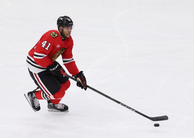 Blackhawks defenseman Isaak Phillips (41) advances the puck in the second period of a preseason game against the Wild at the United Center on Oct. 4, 2024, in Chicago. (John J. Kim/Chicago Tribune)