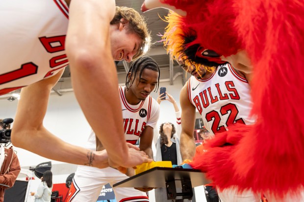 Matas Buzelis, Julian Phillips and Talen Horton-Tucker play Hungry, Hungry Hippos against Benny the Bull on Monday, Sept. 30, 2024, during Bulls media day at the Advocate Center. (Brian Cassella/Chicago Tribune)