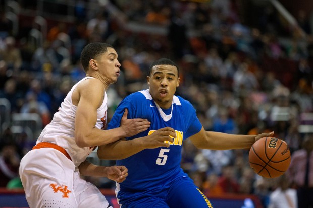 Simeon's Talen Horton-Tucker (5) pushes past Young's Lucas Williamson during overtime of the Class 4A championship game on March 18, 2017, at Carver Arena in Peoria. (Erin Hooley/Chicago Tribune)