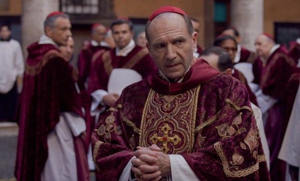 Cardinal Lawrence (Ralph Fiennes) presides over a secret-laden papal election in "Conclave." (Focus Features)