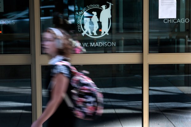 People walk by Chicago Public Schools headquarters on May 28, 2024. (Antonio Perez/Chicago Tribune)