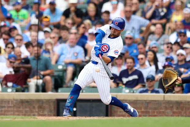 Chicago Cubs first base Michael Busch (29) hits in the eighth inning against the Milwaukee Brewers at Wrigley Field on July 24, 2024. (Eileen T. Meslar/Chicago Tribune)