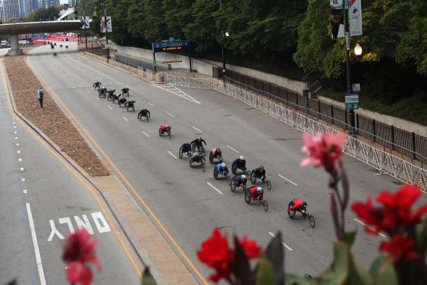 Wheelchair athletes head north on Columbus Avenue in Grant Park to start the Chicago Marathon on Oct. 13, 2024. (Tess Crowley/Chicago Tribune)