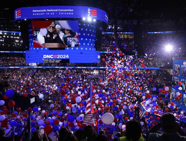 Democratic presidential nominee Vice President Kamala Harris celebrates her nomination as balloons fall onto the celeration on Aug. 22, 2024, during the Democratic National Convention at the United Center. (Brian Cassella/Chicago Tribune)