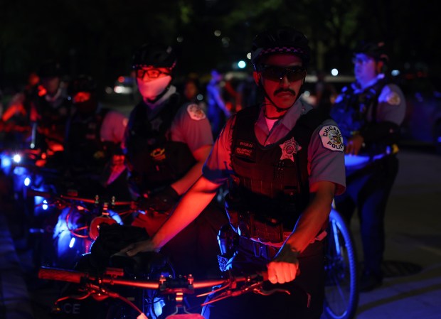 Police officers stand guard at Union Park after a march to protest the Israel-Hamas war while the Democratic National Convention takes place at the United Center on Aug. 21, 2024, in Chicago. (John J. Kim/Chicago Tribune)