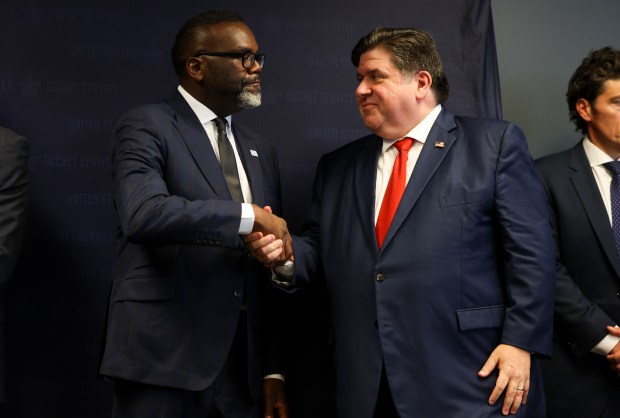 Mayor Brandon Johnson and Gov. JB Pritzker shake hands after a press conference at the United States Secret Service Field Office regarding the security measures for the 2024 Democratic National Convention on July 25, 2024. (Eileen T. Meslar/Chicago Tribune)