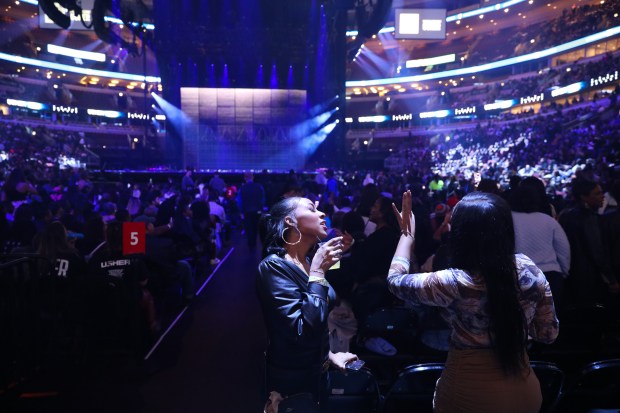 Usher fans dance in the aisle prior to the singer performing during night one of his three night stay at the United Center as part of the Past Present Future Tour on Oct. 28, 2024. (Talia Sprague/for the Chicago Tribune)