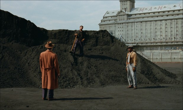 Guy Pearce, Adrien Brody and Isaach de Bankolé in "The Brutalist." (A24)