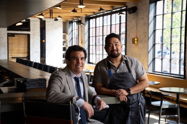 Maxwells Trading chef/partner Erling Wu-Bower with executive chef Chris Jung at their restaurant in the West Loop neighborhood on Sept. 11, 2024. (E. Jason Wambsgans/Chicago Tribune)