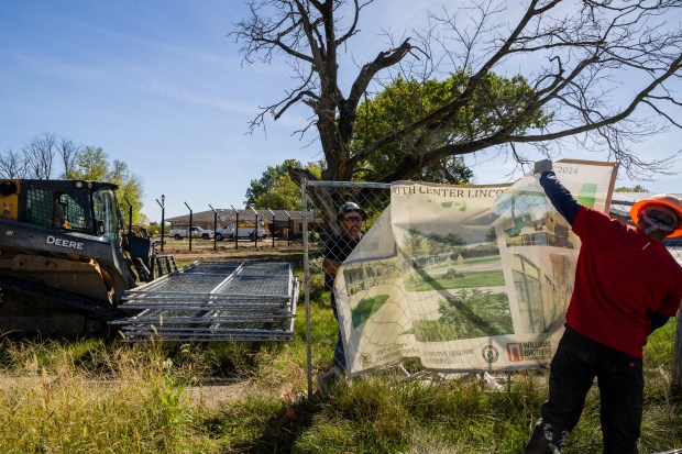 Construction workers work on the Illinois Youth Center at the site of the former Lincoln Developmental Center in Lincoln, Illinois, on Oct. 2, 2024. (Tess Crowley/Chicago Tribune)