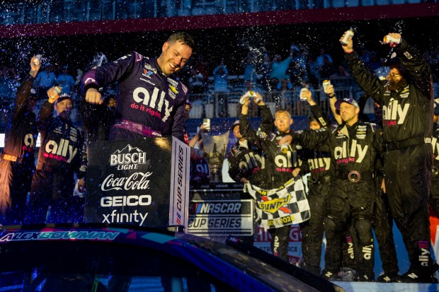 Alex Bowman #48 celebrates with his teammates after winning the Grant Park 165 of the NASCAR Street Race on July 7, 2024, at Grant Park in Chicago. (Vincent Alban/Chicago Tribune)