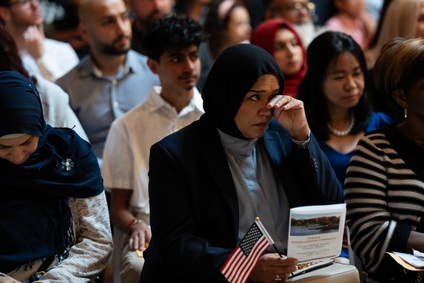 Syeda Razyi, originally from India, is among the 136 people from 41 countries to receive their citizenship at a naturalization ceremony at the Chicago Botanic Garden in Glencoe on Oct. 11, 2024. (E. Jason Wambsgans/Chicago Tribune)