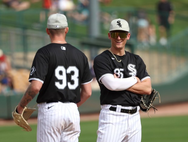 White Sox shortstop prospect Colson Montgomery, right, chats with pitcher Justin Anderson during a spring training game against the Mariners at Camelback Ranch on Feb. 24, 2024, in Glendale, Ariz. (Stacey Wescott/Chicago Tribune)