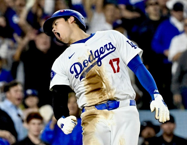 The Dodgers' Shohei Ohtani scores on a single by Freddie Freeman against the Mets in the fourth inning of Game 1 of the National League Championship Series on Sunday, Oct. 13, 2024, at Dodger Stadium in Los Angeles. (Keith Birmingham/Orange County Register)