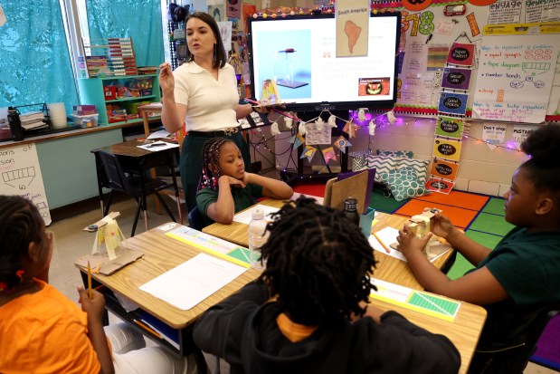 Lauren McDonough goes through class instructions with her third grade students. (Antonio Perez/Chicago Tribune)