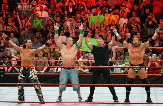 From left, Wrestler Shawn Michaels, World Wrestling Entertainment Inc. Chairman Vince McMahon, and wrestlers John Cena and Triple H pose in the ring during the WWE Monday Night Raw show at the Thomas & Mack Center, Aug. 24, 2009, in Las Vegas, Nevada. (Ethan Miller/Getty Images)