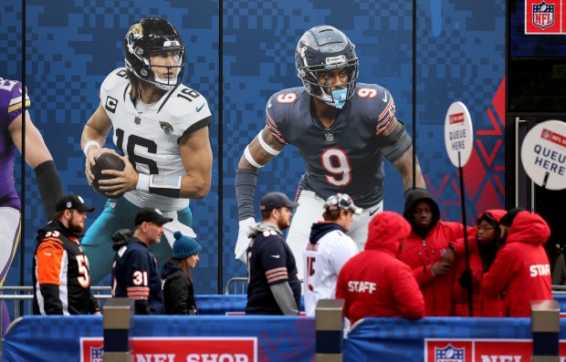 Images of Jacksonville Jaguars quarterback Trevor Lawrence (16) and Chicago Bears safety Jaquan Brisker (9) are seen outside of Tottenham Hotspur Stadium in London as Bears fans arrive for the game on Oct. 13, 2024.  (Chris Sweda/Chicago Tribune)