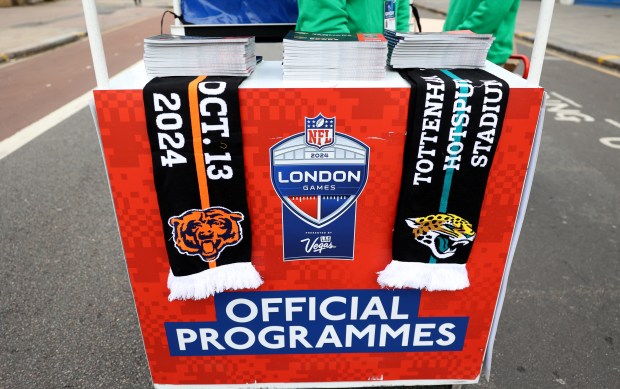 Progams and scarfs are seen for sale outside of Tottenham Hotspur Stadium in London prior to a game between the Chicago Bears and the Jacksonville Jaguars on Oct. 13, 2024.  (Chris Sweda/Chicago Tribune)