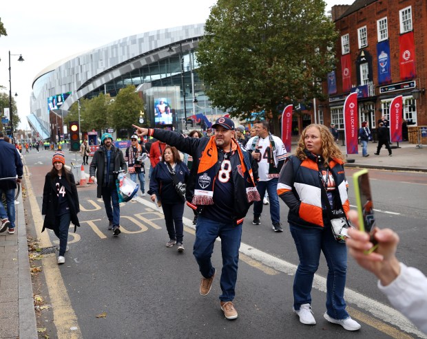 Chicago Bears fans stroll around outside of Tottenham Hotspur Stadium in London before a game between the Bears and the Jacksonville Jaguars on Oct. 13, 2024.  (Chris Sweda/Chicago Tribune)