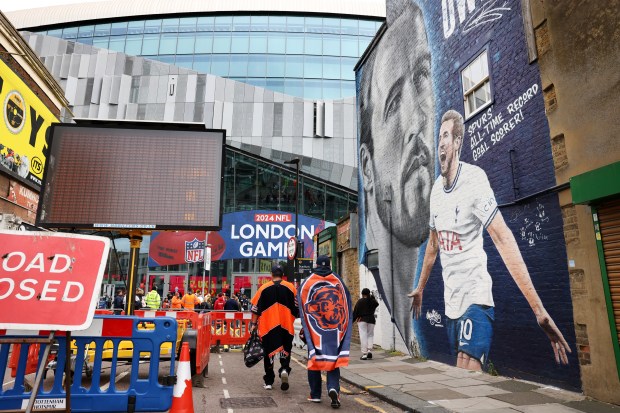 Chicago Bears fans stroll around outside of Tottenham Hotspur Stadium in London before a game between the Bears and the Jacksonville Jaguars on Oct. 13, 2024.  (Chris Sweda/Chicago Tribune)