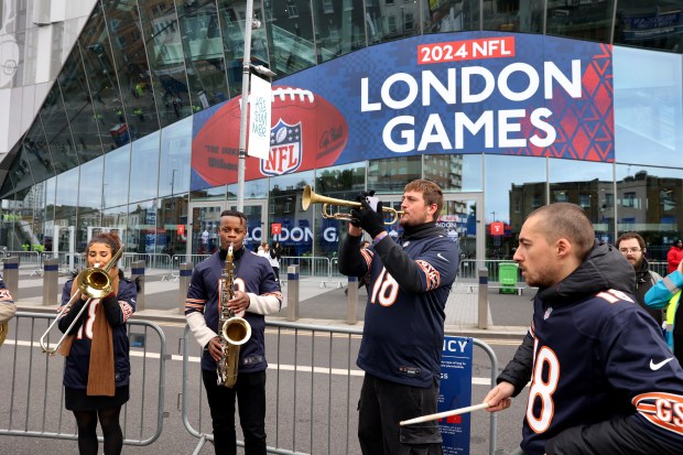 A band performs outside of Tottenham Hotspur Stadium in London prior to a game between the Chicago Bears and the Jacksonville Jaguars on Oct. 13, 2024.  (Chris Sweda/Chicago Tribune)